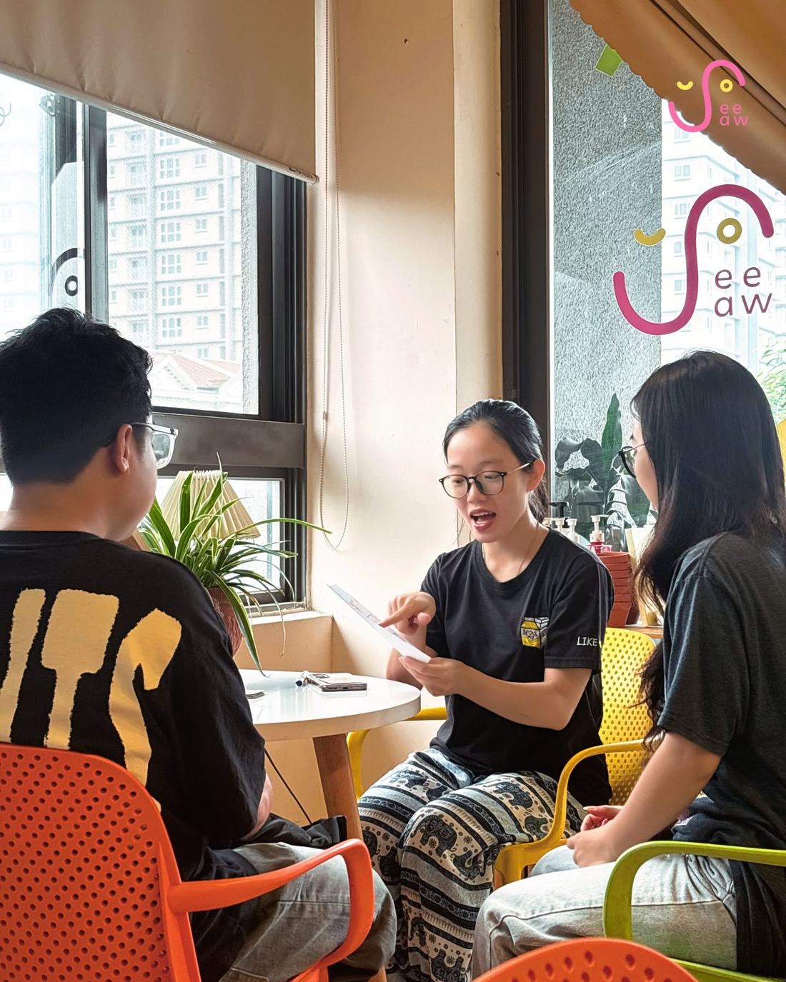 Founders chatting in a cozy corner of the SeeSaw co-working space