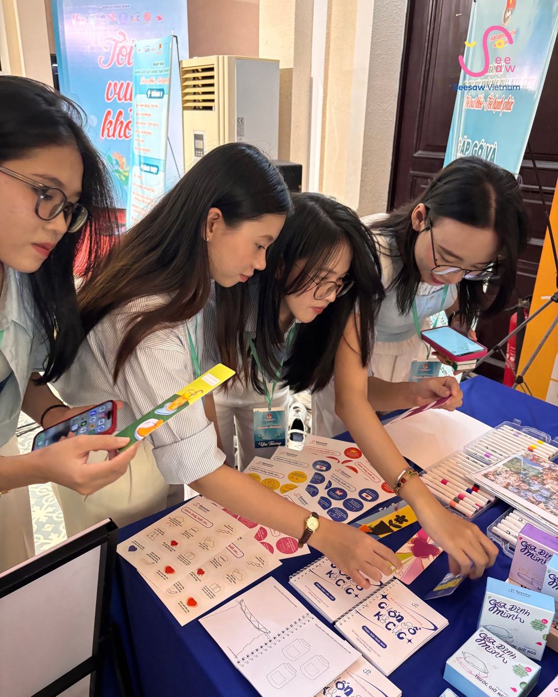SeeSaw's memory journals and conversation card sets on display at a community event